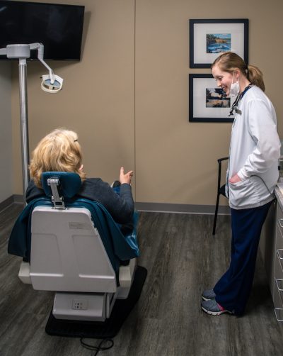 Dentist talking to patient