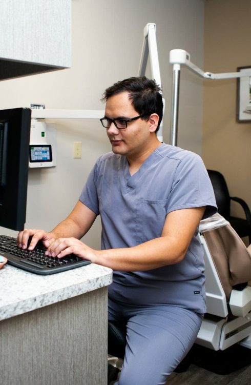 Dental Employee Working at desk